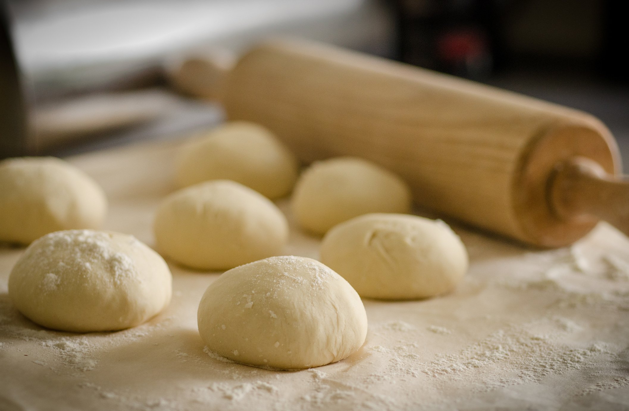 Wheat Beside Brown Wooden Rolling Pin